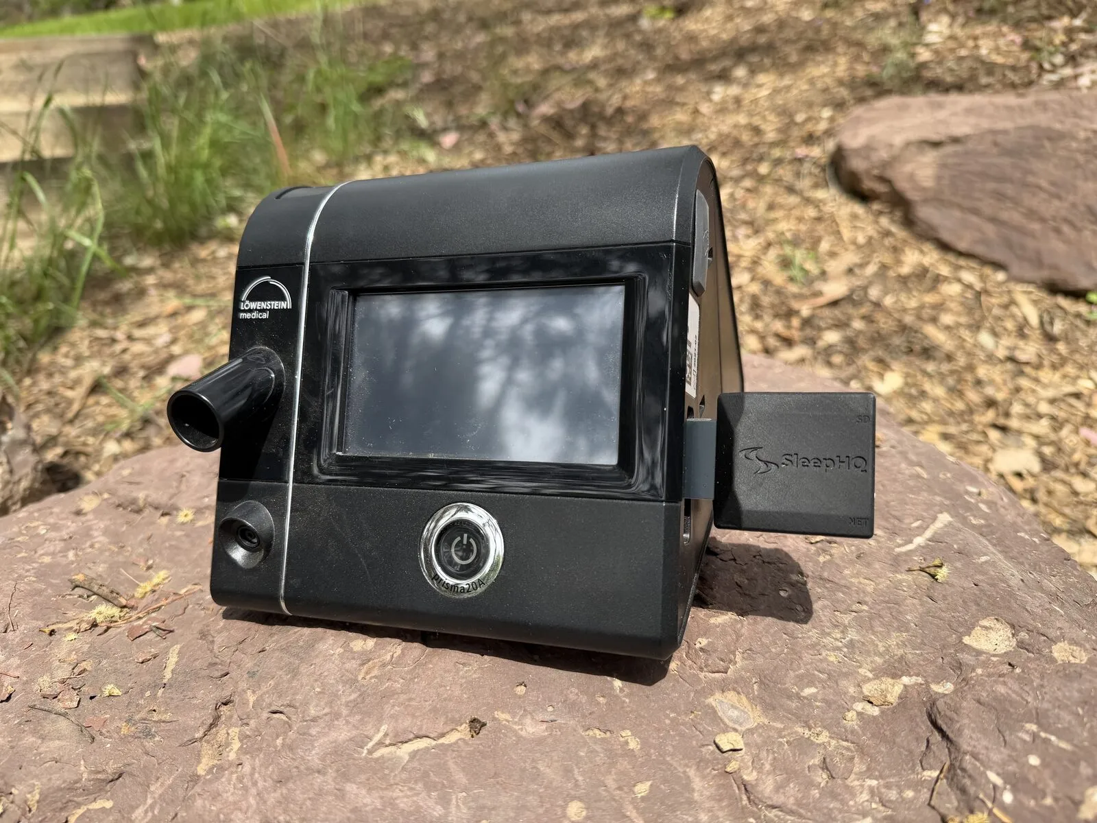 A MUX inserted in the SD card slot on the side of a black Löwenstein prisma20A
