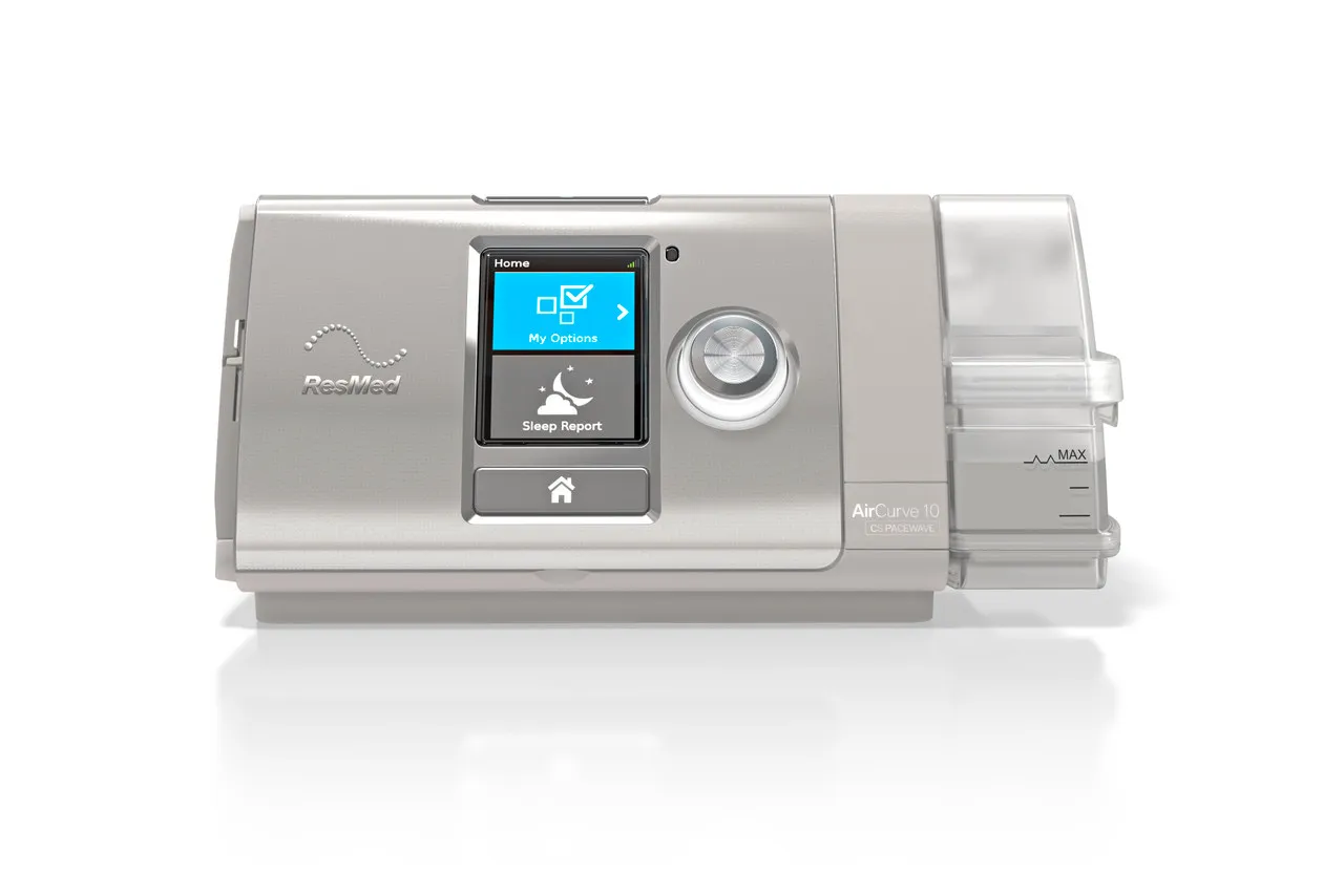 A ResMed AirCurve 10 CS PaceWave, seen front on with its humidifier attached